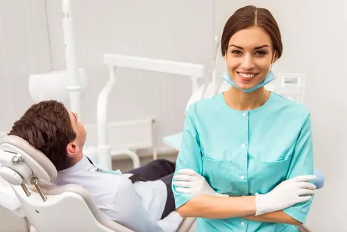 dentist with patient in dental chair