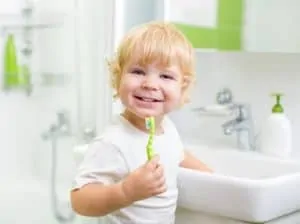 toddler boy brushing teeth